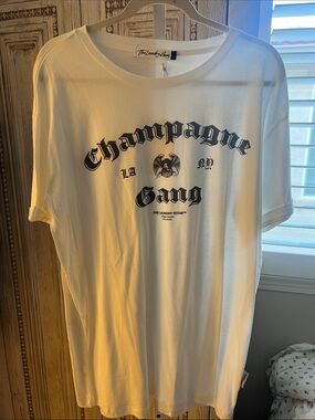 The Laundry Room White Tee with Black 'Champagne Gang' Graphic